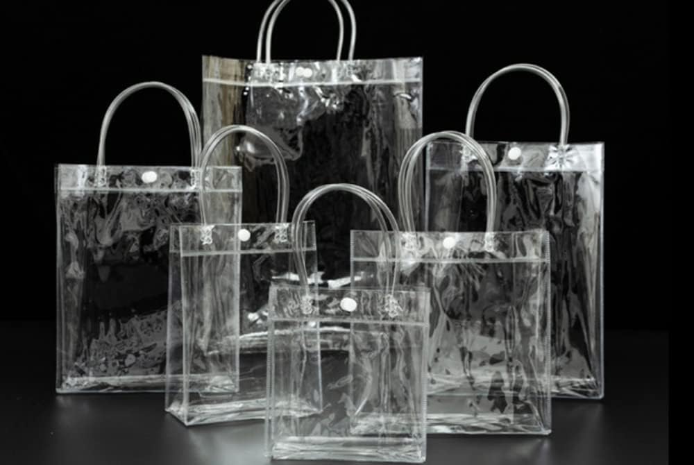 Rikyo 20pc Clear PVC Gift Bags with Handle and Button